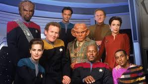 The cast of Deep Space Nine, including Worf, Dax, Bashier, Quark, O'Brien, Odo, Sisko, Jake, and Kira.