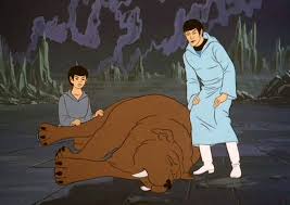 Young Spock and Older Spock looking over his pet after it was bitten 
