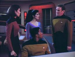 Troi, O'Brien, Ro, and Mandel on the bridge trying to figure out what to do.