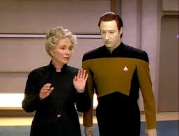 Dr. Juliana and Data walk the halls of the Enterprise