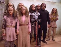 A group of Klingon youths surround Worf, demanding to be allowed to leave or else kill them too.