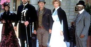 from left to right: Troi, Riker, Picard, Crusher, and La Forge all in period dress