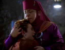 Kai Opaka hugging Major Kira