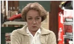 A woman with her eyes squinted