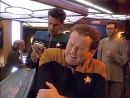 Bashir checking out O'Brien after he "hurt" his shoulder