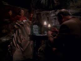 Odo working on the generator and Kira stuck in crystal