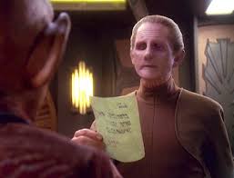 Odo reading a note that Rom left Quark