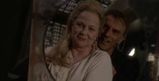 Dukat and Winn embrace in a mirror