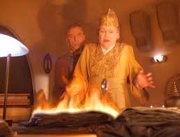 The bad book is on fire because Winn used blood