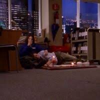 Jeremy asleep on Natalie's lap while she drinks wine