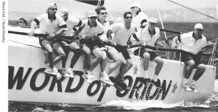 The Sword of Orion yacht with some men sitting on it (black and white image)