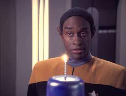 Tuvok with a birthday cake and one candle