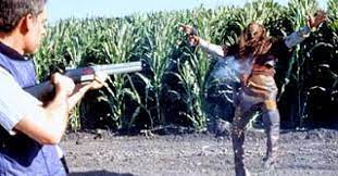 A man shoots a Klingon with a shotgun