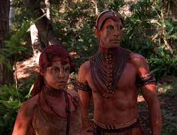 A native alien man, the chief, and one of the young women of the tribe