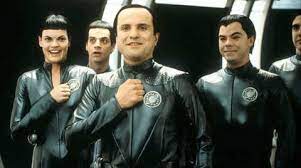 The Themarians holding their fist to their chest in salute (the main 4)