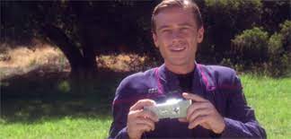 Tucker with a camera in his hand.