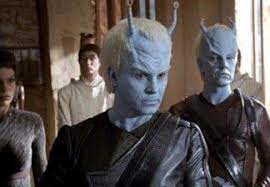 Two Andorians and two Vulcans behind them