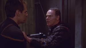 Grat points a gun at Archer