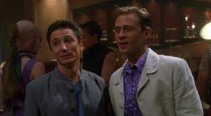 Reed and Tucker in ridiculous suits, on Risa